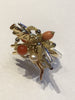 Ring in Yellow Gold with Charms and Coral